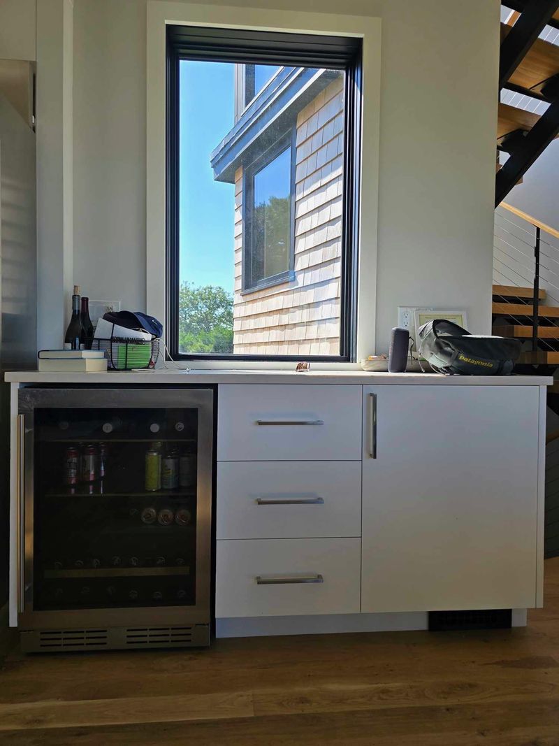 Custom built-in beverage bar cabinet with drawers and refrigerator