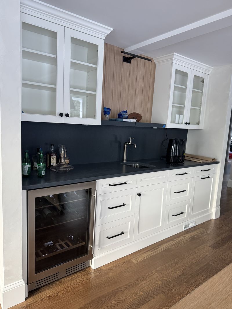 Custom butler's pantry with glass-front cabinets and wine refrigerator