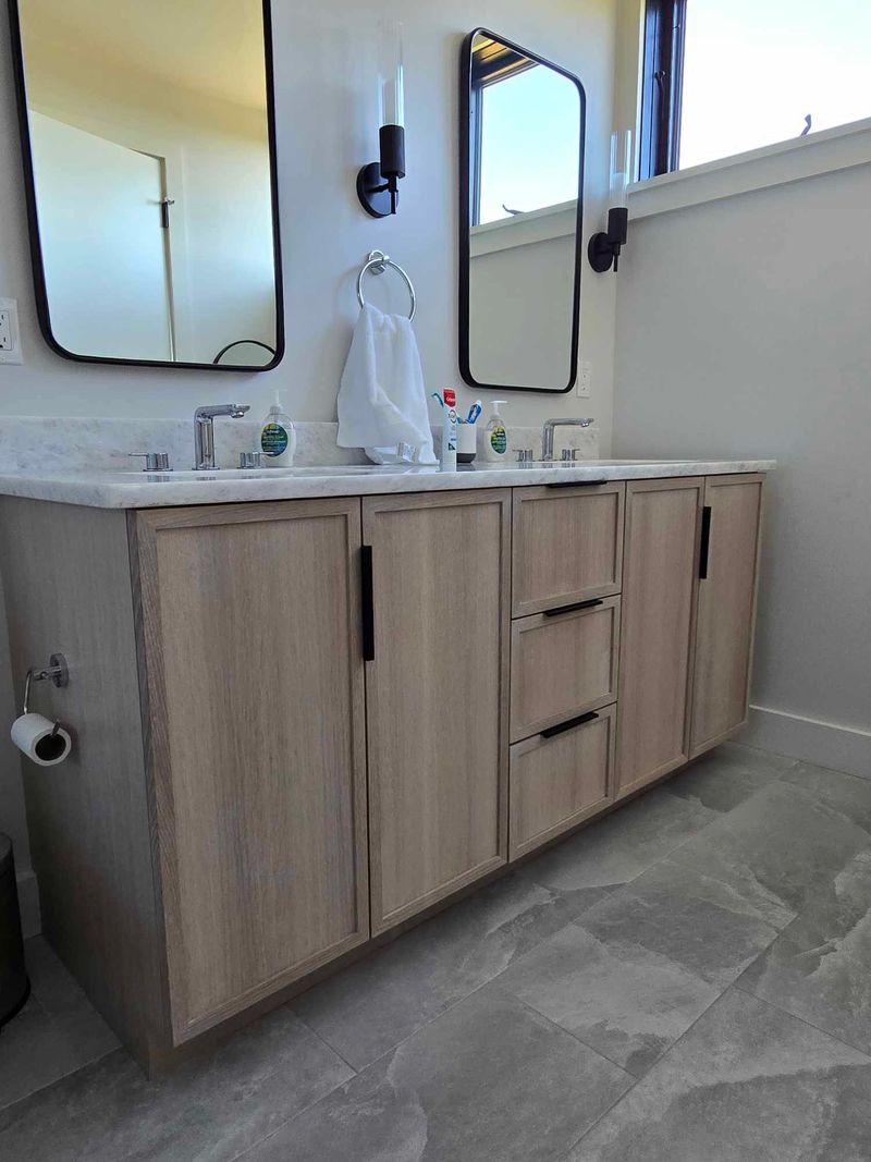 Custom white oak double bathroom vanity with stone countertop